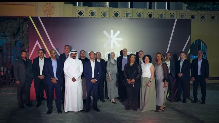 Guests at the TPC 2026 gala evening in front of the Tragency backdrop